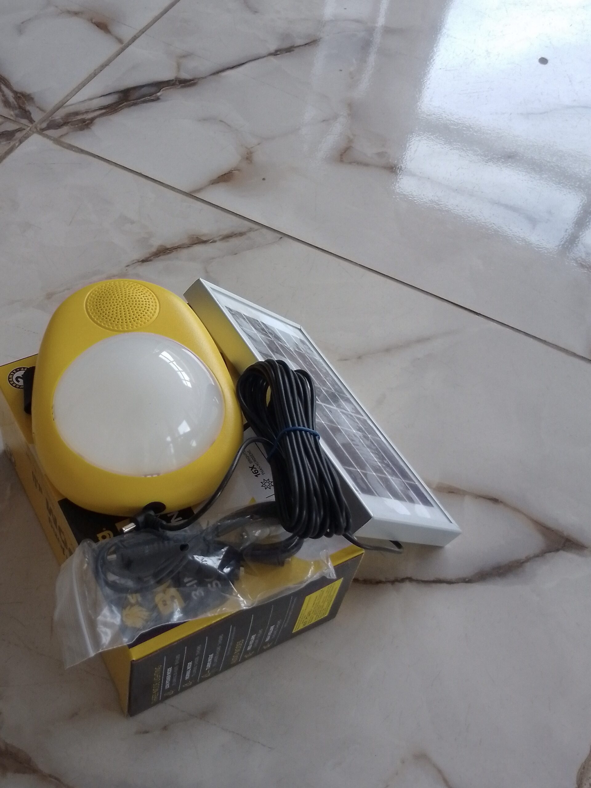 Sun King Boom Solar Lantern Installation Services in Abuja, Nigeria by lumett